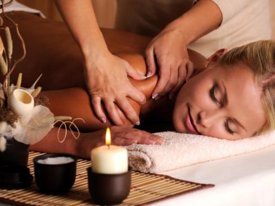 masseur doing massage female shoulder beauty salon (1)